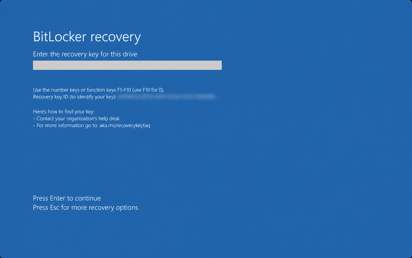 Windows BitLocker recovery screen asking for a recovery key, with the Recovery Key ID redacted